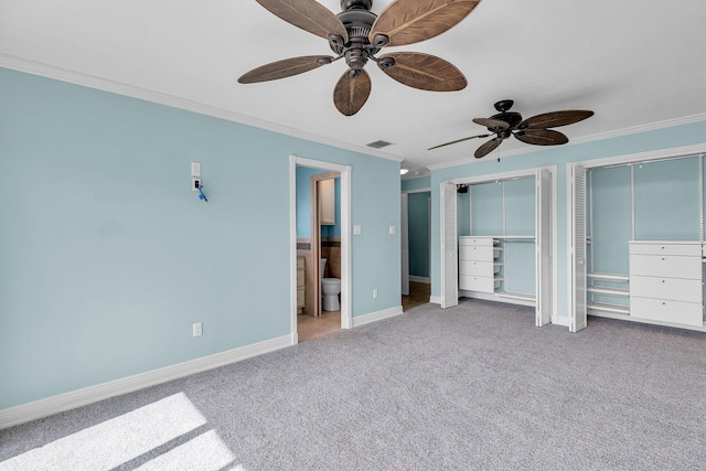 1514 Shaw Dr, Key Largo, FL 33037 - unfurnished bedroom featuring crown molding, carpet floors, multiple closets, ensuite bathroom, and a ceiling fan