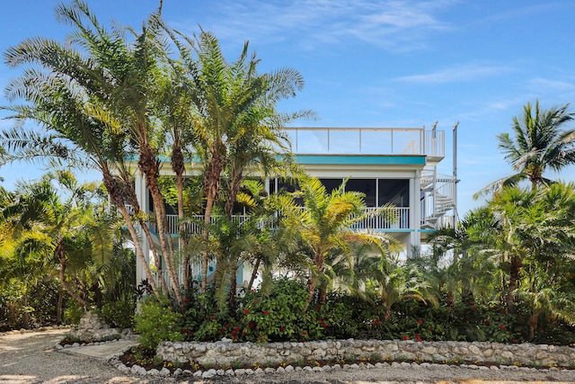 1514 Shaw Dr, Key Largo, FL 33037 - view of side of home featuring a sunroom and a balcony