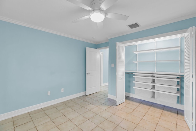 1514 Shaw Dr, Key Largo, FL 33037 - unfurnished bedroom featuring ornamental molding, light tile patterned flooring, ceiling fan, and a closet