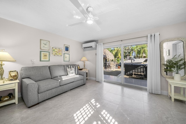 living room featuring light tile patterned floors, ceiling fan, a textured ceiling, a wall mounted air conditioner, and baseboards