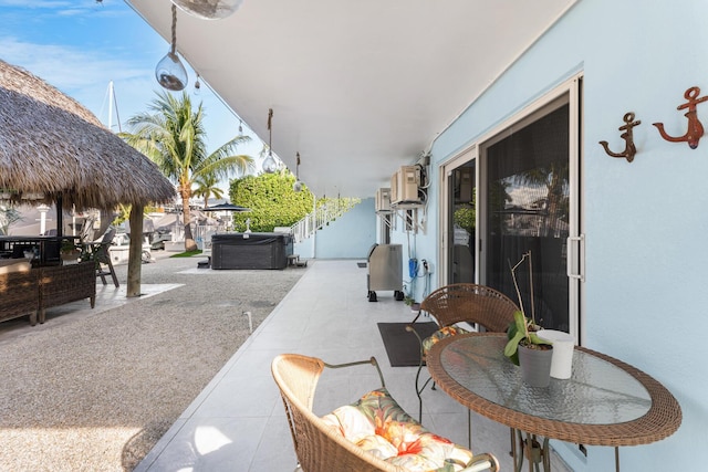 view of patio with a hot tub