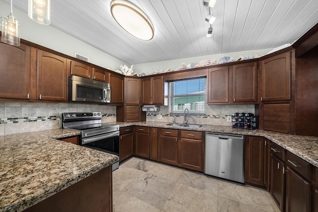 kitchen featuring wooden ceiling, stainless steel appliances, a sink, tasteful backsplash, and pendant lighting