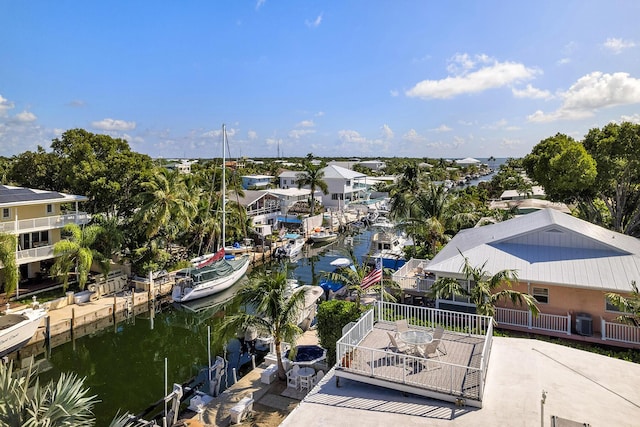 drone / aerial view with a water view and a residential view