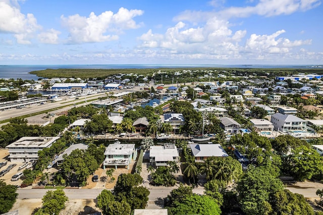 drone / aerial view featuring a water view and a residential view