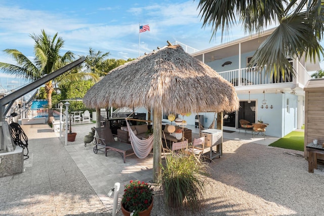 view of community with a patio and a gazebo