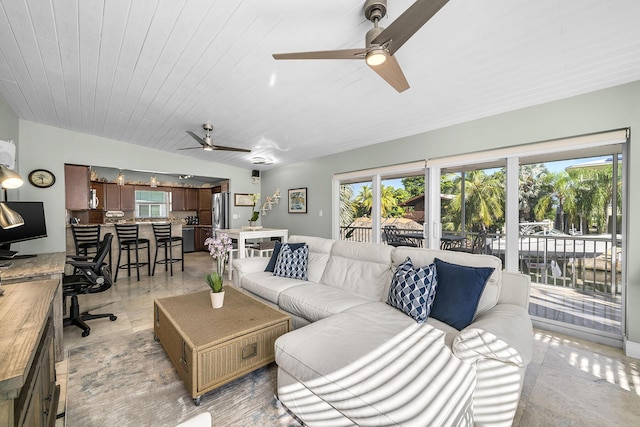 living area with wooden ceiling and ceiling fan