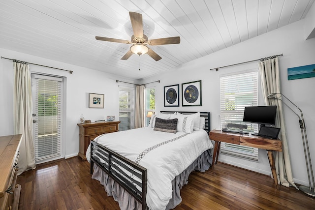 bedroom featuring access to exterior, lofted ceiling, dark wood finished floors, and baseboards