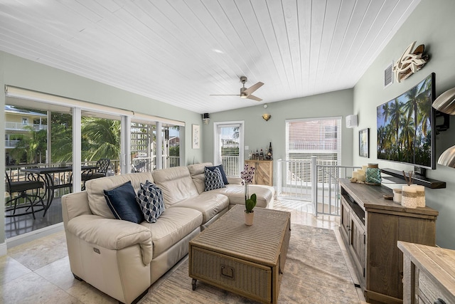 sunroom / solarium featuring wooden ceiling, visible vents, and a ceiling fan