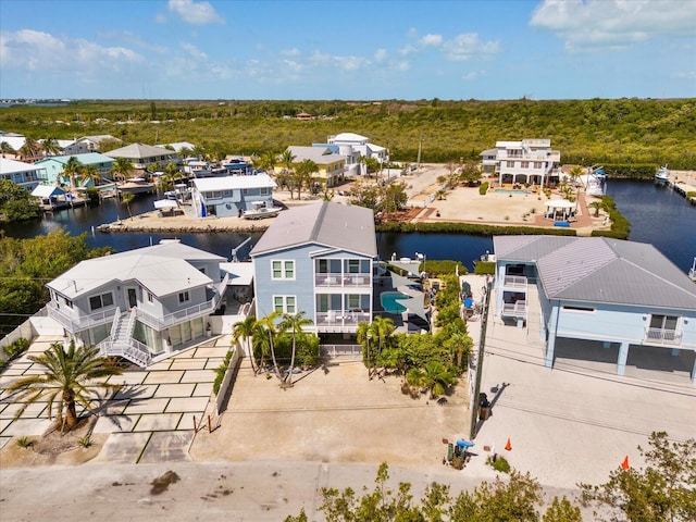 aerial perspective of suburban area featuring a nearby body of water