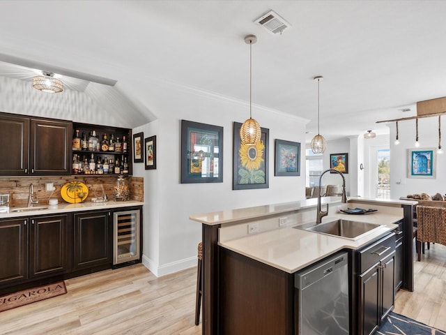 indoor bar with wine cooler, dishwasher, light wood-style flooring, tasteful backsplash, and crown molding