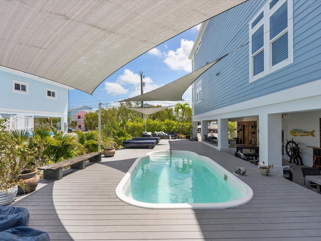 outdoor pool featuring a wooden deck