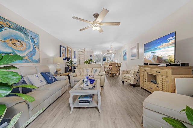 living room featuring ceiling fan and light wood-type flooring