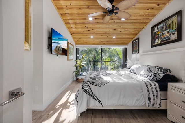 bedroom with vaulted ceiling, wooden ceiling, and light wood-type flooring