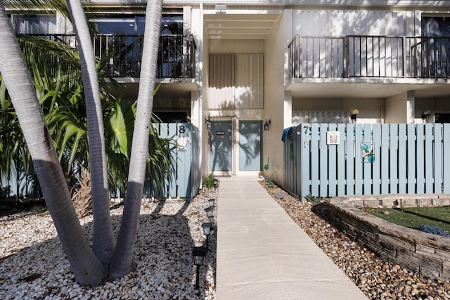 entrance to property featuring a balcony