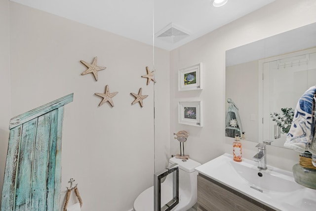 bathroom with vanity and toilet