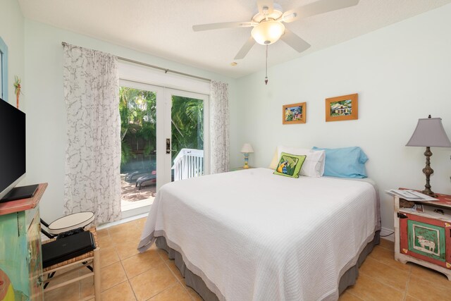 bedroom featuring french doors, ceiling fan, access to exterior, and light tile patterned floors