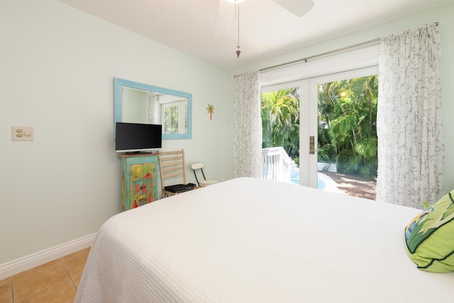 bedroom with french doors, access to exterior, multiple windows, and light tile patterned floors