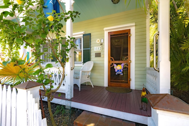 entrance to property featuring a porch