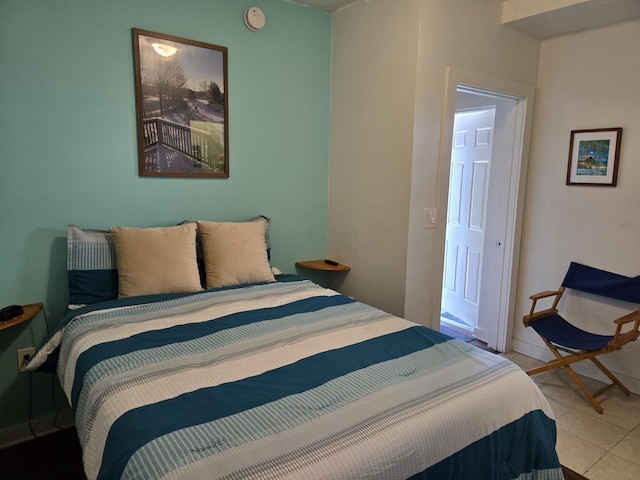 bedroom featuring light tile patterned flooring