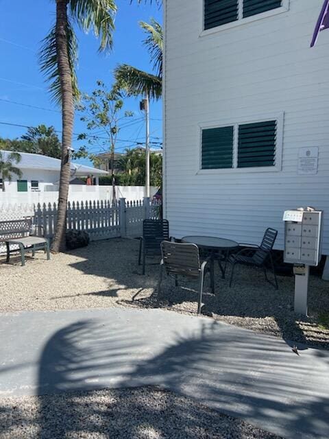 exterior space with mail area and fence