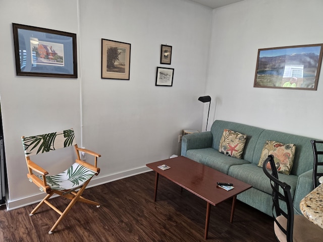 living room featuring wood finished floors and baseboards