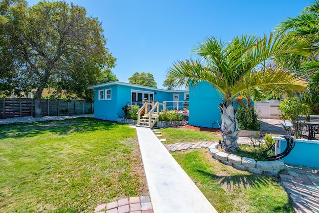 24 Cactus Dr, Big Coppitt, FL 33040 - view of front of property featuring a front yard and a fenced backyard