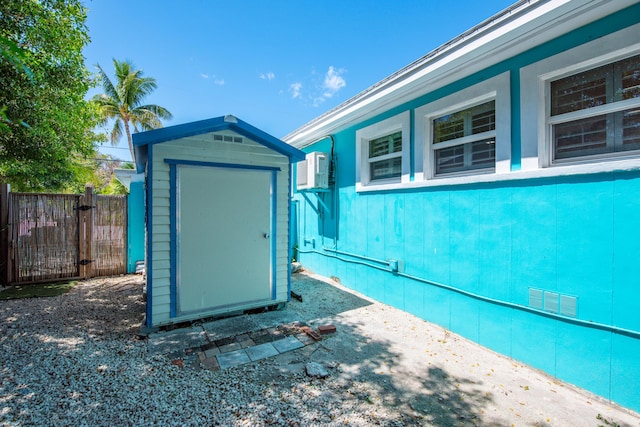24 Cactus Dr, Big Coppitt, FL 33040 - view of shed featuring a wall unit AC and fence
