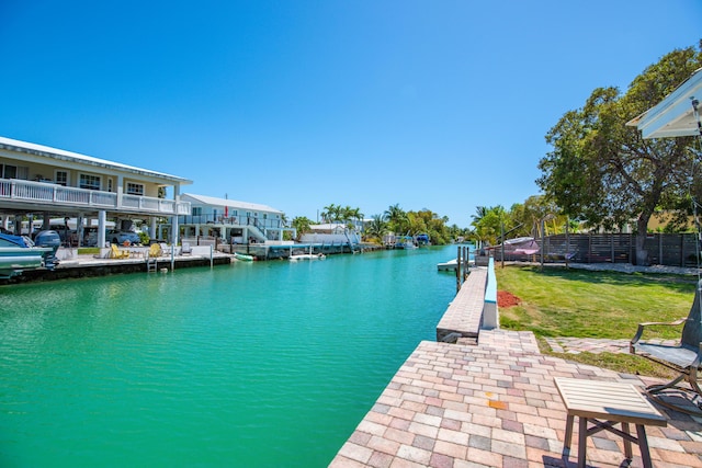 24 Cactus Dr, Big Coppitt, FL 33040 - view of dock with a yard, fence, and a water view