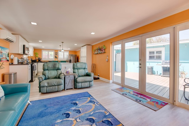 24 Cactus Dr, Big Coppitt, FL 33040 - living area featuring baseboards, recessed lighting, an AC wall unit, crown molding, and light wood-type flooring