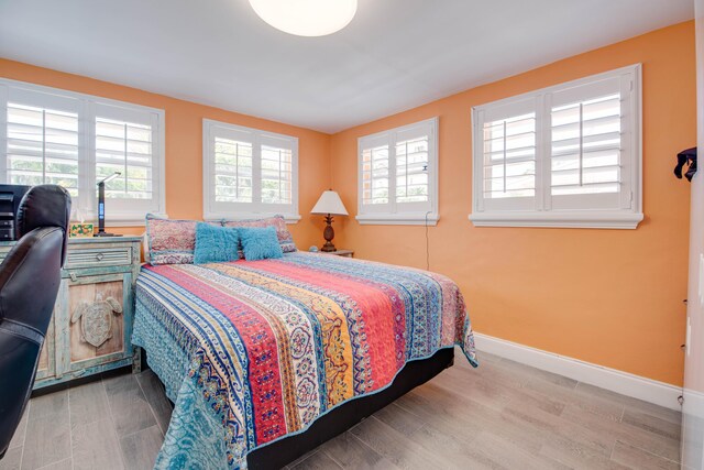 24 Cactus Dr, Big Coppitt, FL 33040 - bedroom featuring baseboards and wood finished floors