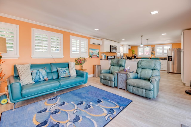 24 Cactus Dr, Big Coppitt, FL 33040 - living area featuring a wall mounted air conditioner, light wood-style floors, and ornamental molding