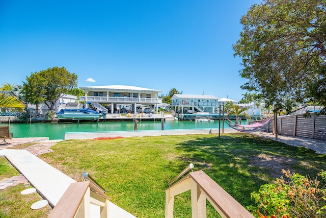 24 Cactus Dr, Big Coppitt, FL 33040 - dock area featuring a yard, a water view, and fence