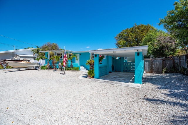 24 Cactus Dr, Big Coppitt, FL 33040 - view of front of house featuring a carport and fence