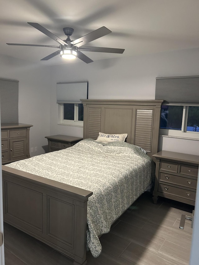 bedroom featuring hardwood / wood-style flooring and ceiling fan