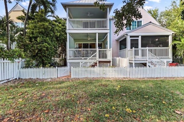 11 Kestral Way, Key West, FL 33040 - view of front of house featuring a sunroom, a front yard, and ceiling fan