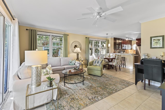 11 Kestral Way, Key West, FL 33040 - living room featuring ceiling fan, plenty of natural light, ornamental molding, and light tile patterned floors