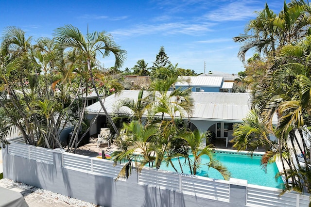 outdoor pool featuring fence private yard