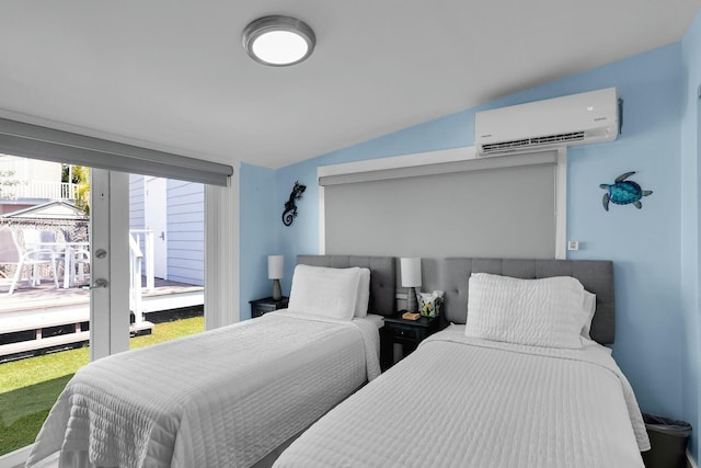 bedroom featuring vaulted ceiling, access to outside, and a wall unit AC