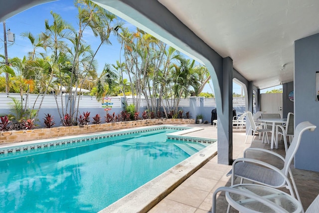 view of pool featuring a fenced backyard, a patio, and a fenced in pool