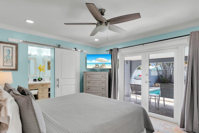 bedroom with connected bathroom, a barn door, ornamental molding, and access to exterior