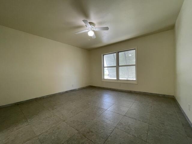 1608 Venetian Dr, Key West, FL 33040 - empty room with ceiling fan and baseboards