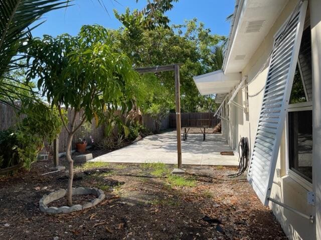 1608 Venetian Dr, Key West, FL 33040 - fenced backyard with a patio area