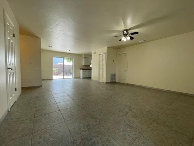 1608 Venetian Dr, Key West, FL 33040 - unfurnished living room featuring a ceiling fan and tile patterned flooring