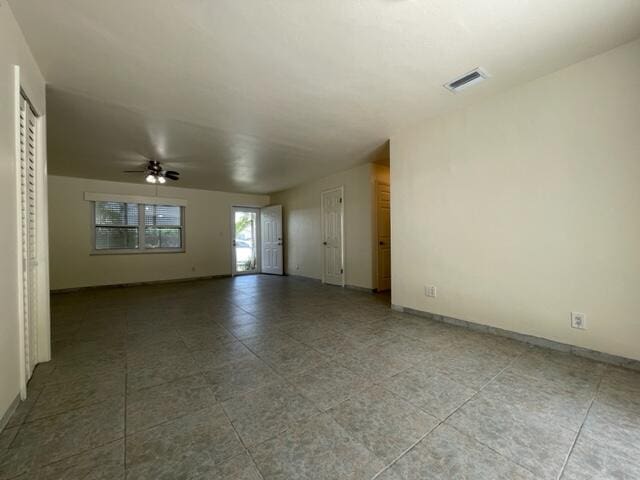 1608 Venetian Dr, Key West, FL 33040 - tiled empty room featuring ceiling fan and baseboards