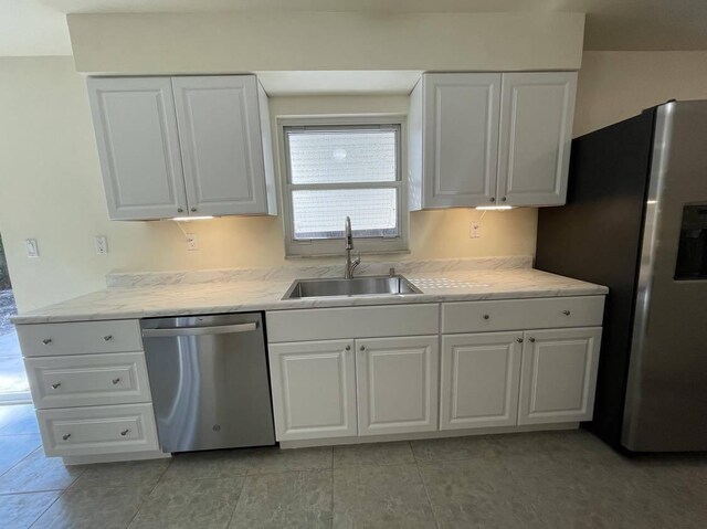 1608 Venetian Dr, Key West, FL 33040 - kitchen featuring appliances with stainless steel finishes, white cabinets, and light countertops