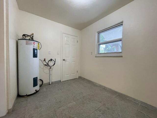 1608 Venetian Dr, Key West, FL 33040 - utility room featuring water heater