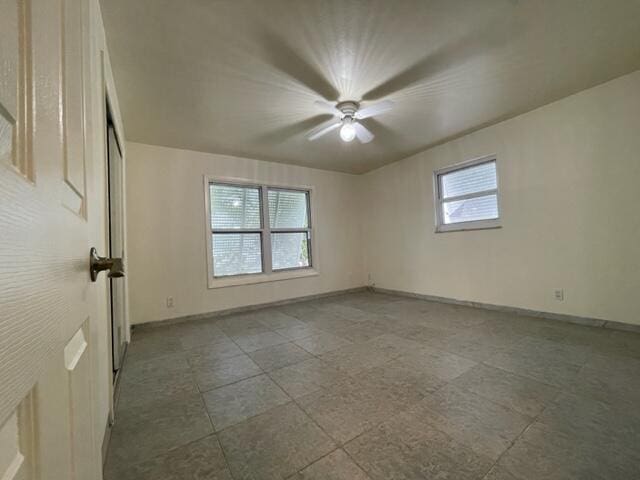 1608 Venetian Dr, Key West, FL 33040 - empty room with healthy amount of natural light and a ceiling fan