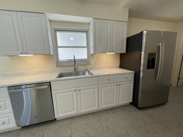 1608 Venetian Dr, Key West, FL 33040 - kitchen featuring stainless steel appliances, white cabinets, light countertops, and light tile patterned floors