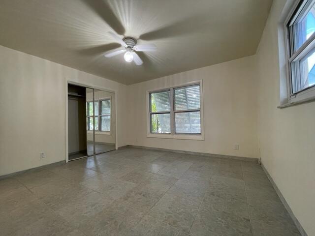1608 Venetian Dr, Key West, FL 33040 - unfurnished bedroom featuring a closet and a ceiling fan