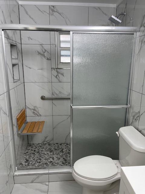 1608 Venetian Dr, Key West, FL 33040 - bathroom featuring marble finish floors, a marble finish shower, and vanity